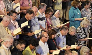 Members of the Church of England's Synod join in morning prayers